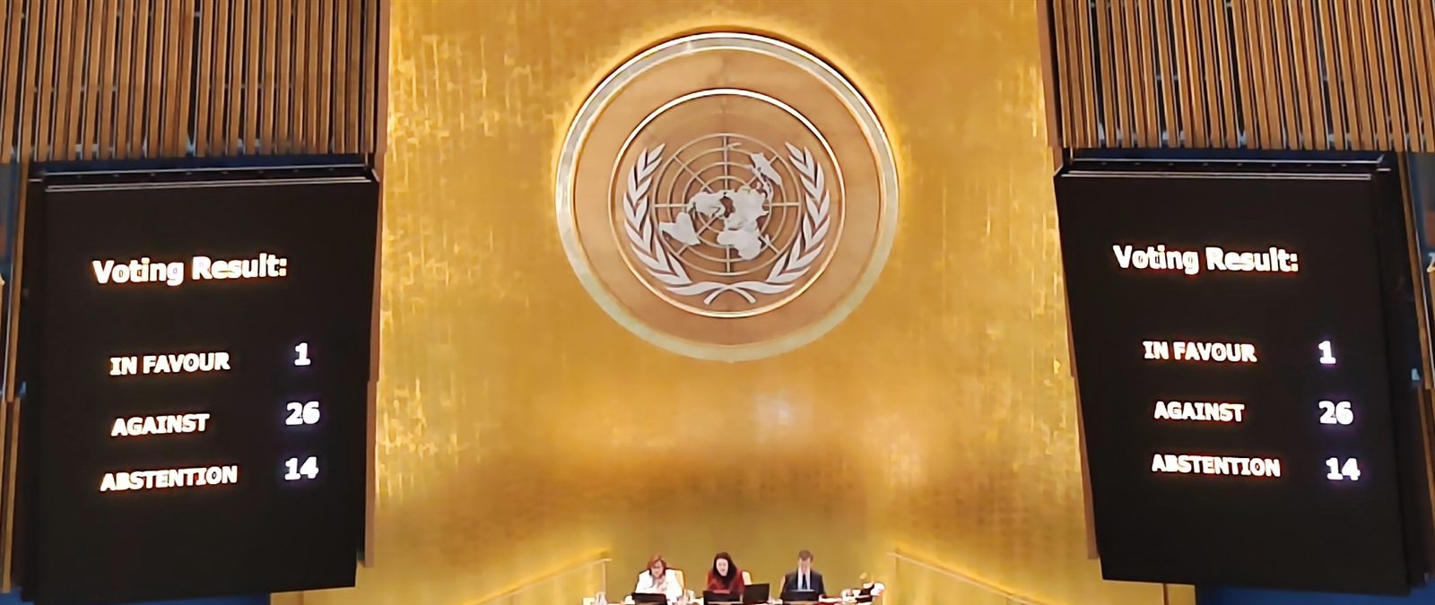 The United Nations General Assembly Hall during a vote, with the result shown on the screens