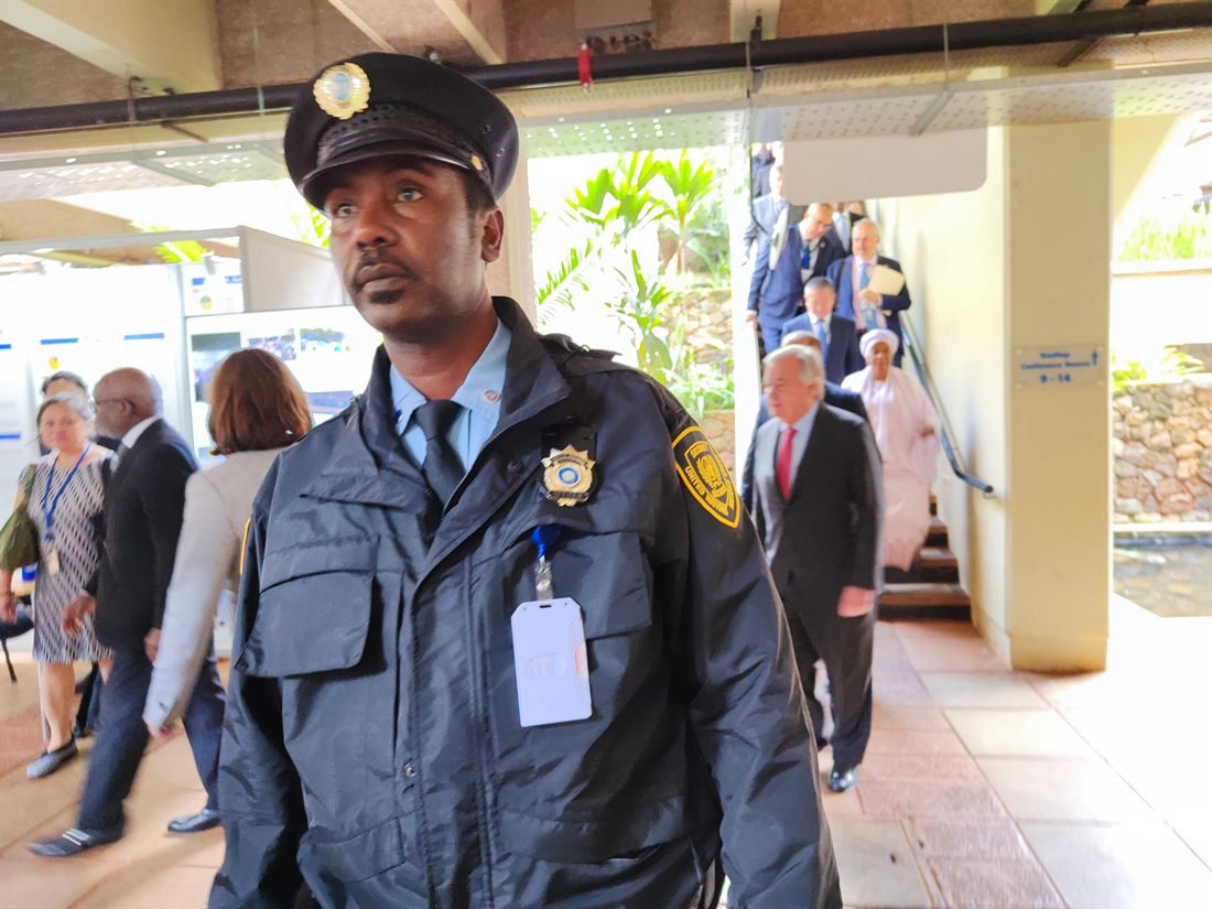 A UN security officer as Secretary-General Ant&oacute;nio Guterres walks through the UN Office at Nairobi